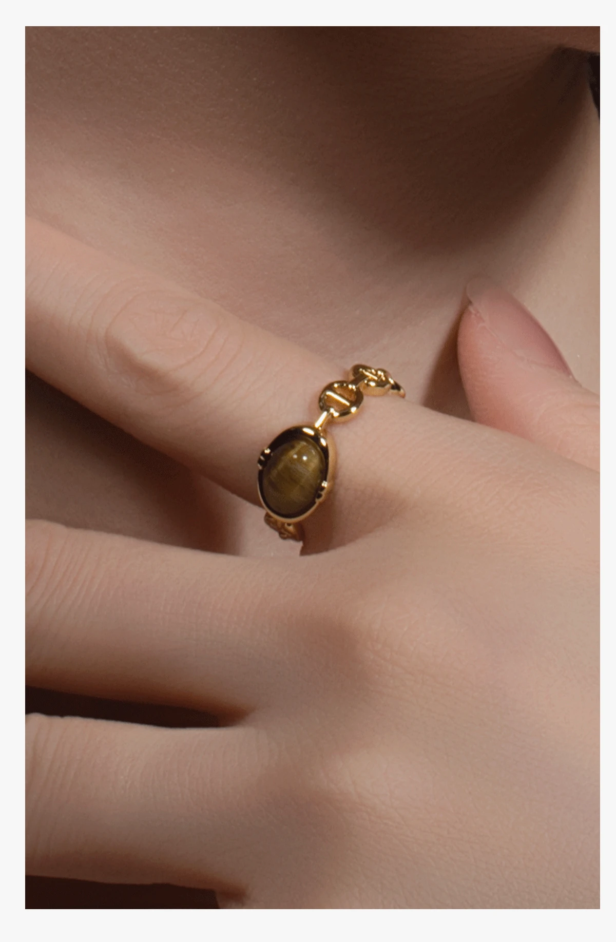 Model wearing The Anchored Core tiger eye ring